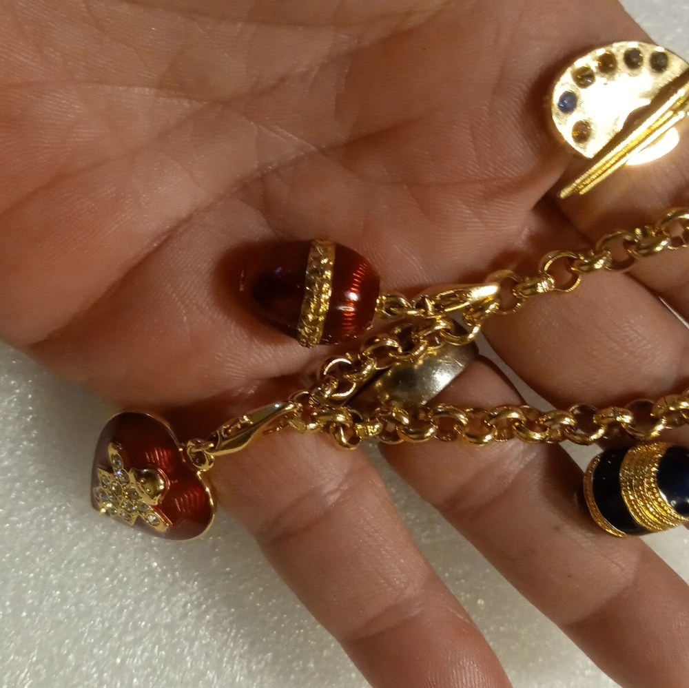 Faberge egg charm bracelet on a gold tone rolo chain. - Picture 3 of 16